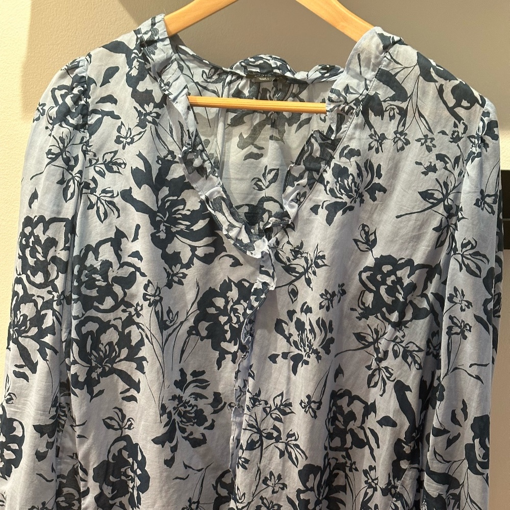 Floral Shirt with ruffle around the nick.